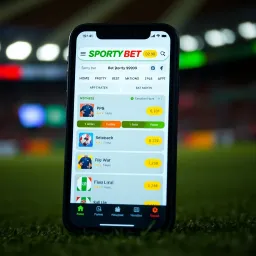 Mobile phone screen displaying SportyBet app interface with betting options